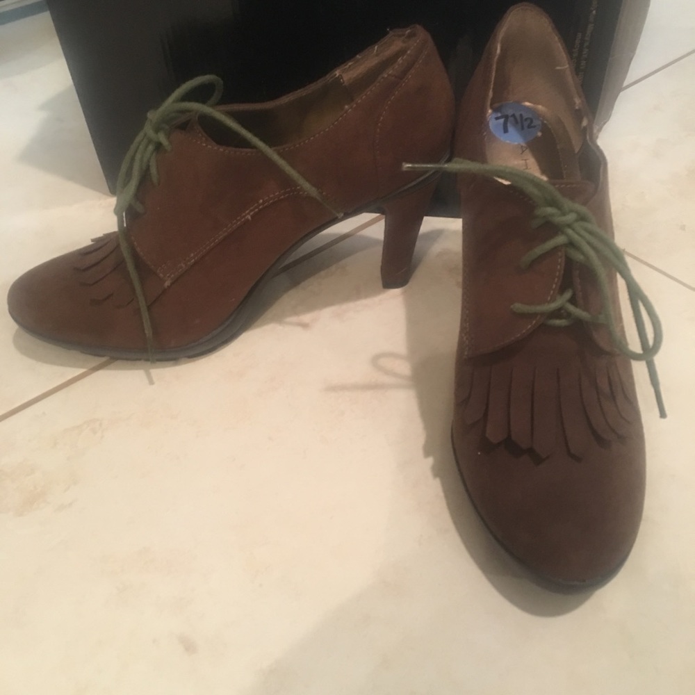 Like new brown Suede heels. Only worn once.